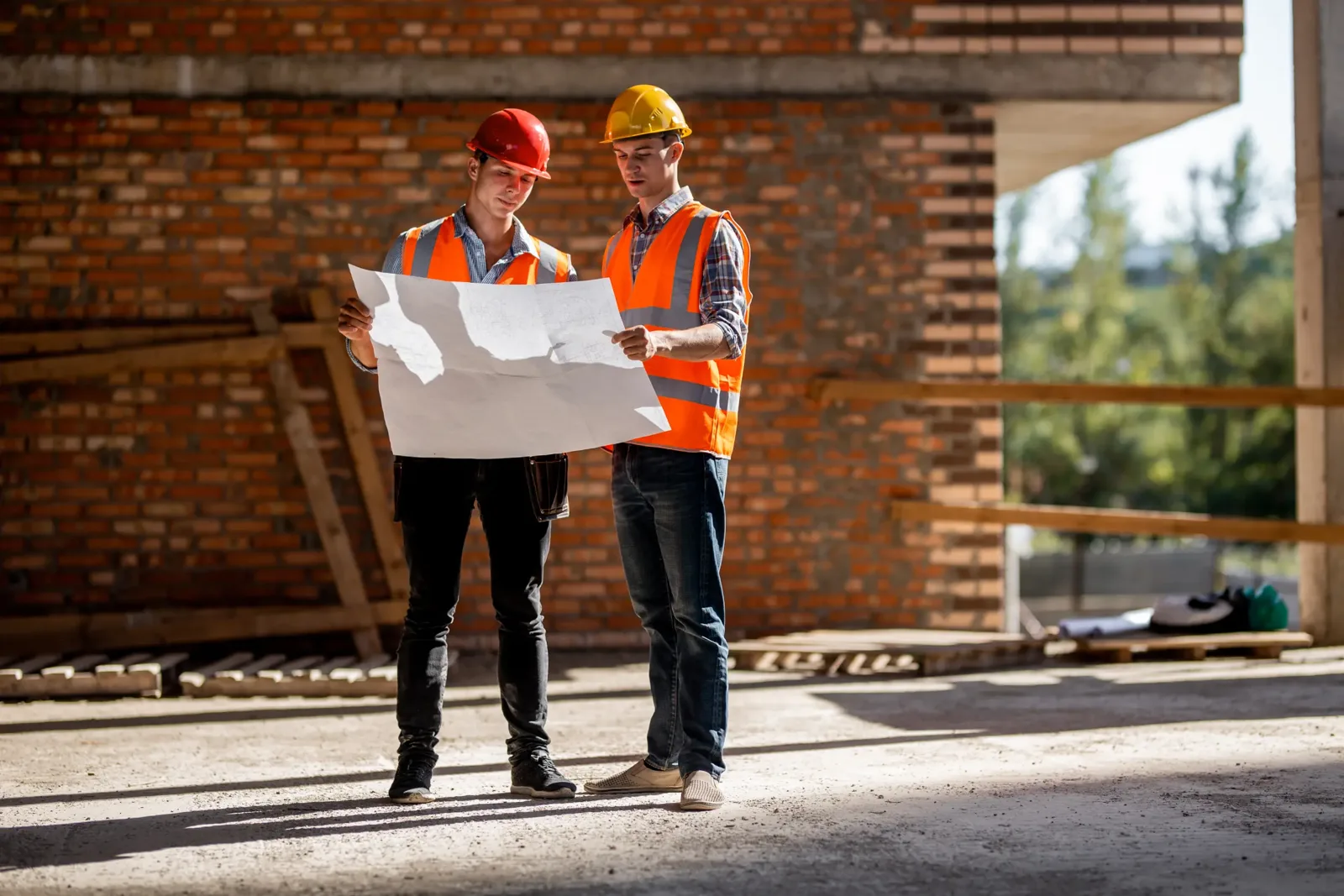 Builders reviewing plans on site, home renovation experts for Epping